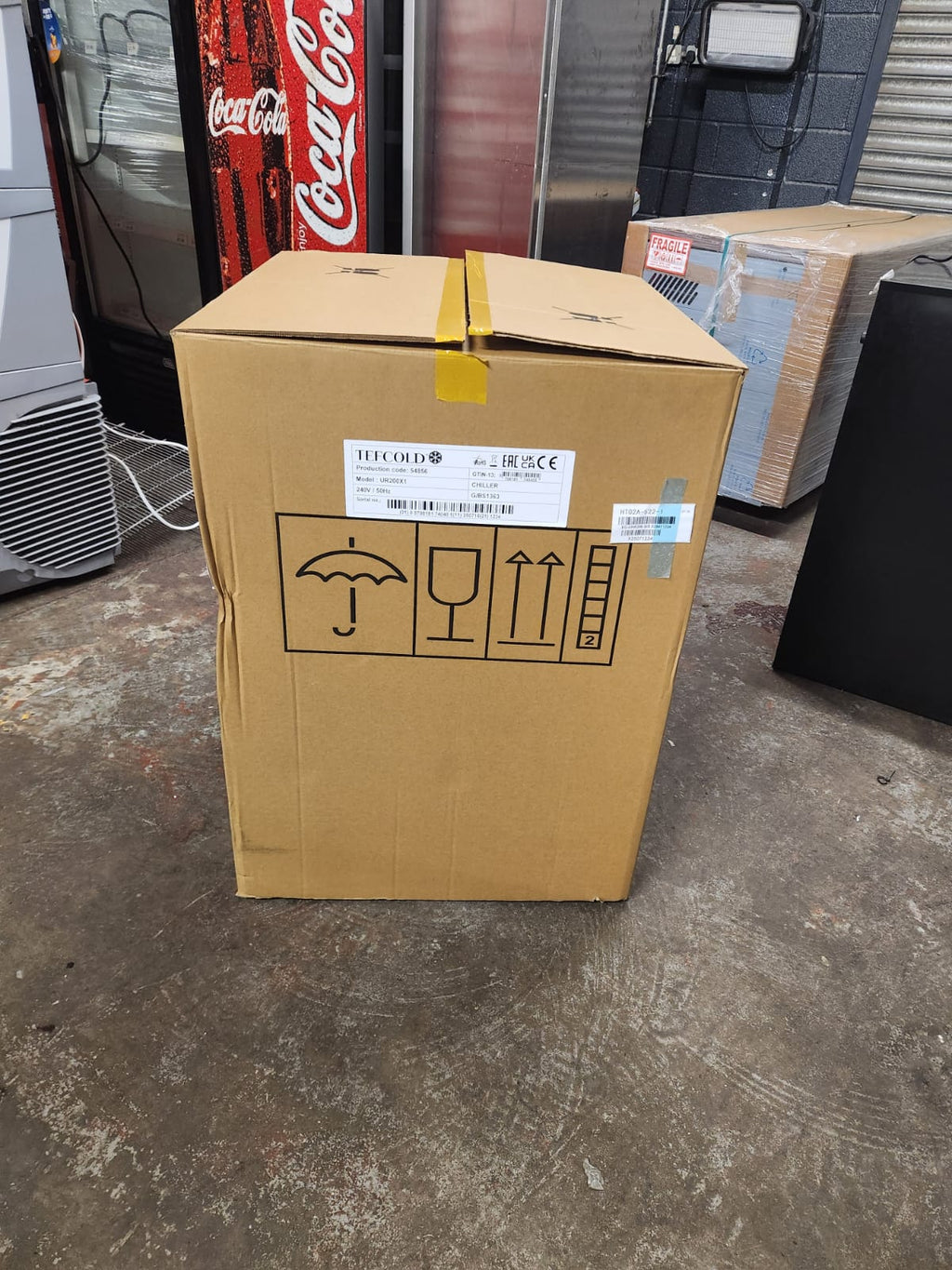 Tefcold UR200X1 — energy label showing A+ rating, 215 kWh/annum, 66L